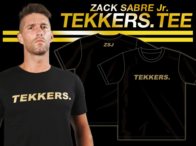 新日本プロレスリング/新日本プロレスリング/ザック・セイバーJr.「TEKKERS.」Tシャツ（ゴールド）